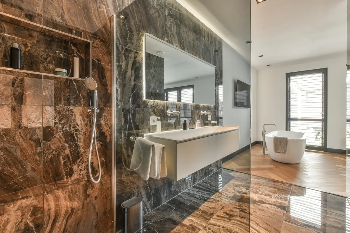 Natural stone spacious dark bathroom design instirations Toronto