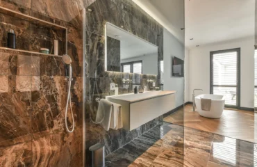 Natural stone spacious dark bathroom design instirations Toronto