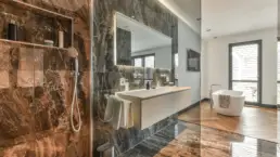 Natural stone spacious dark bathroom design instirations Toronto